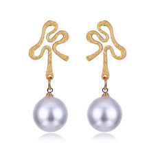 Elegant White/Black Simulated Pearls Statement Earrings